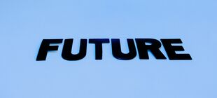 Das Wort „Future“ ist in schwarzer Farbe auf blauem Hintergrund geschrieben