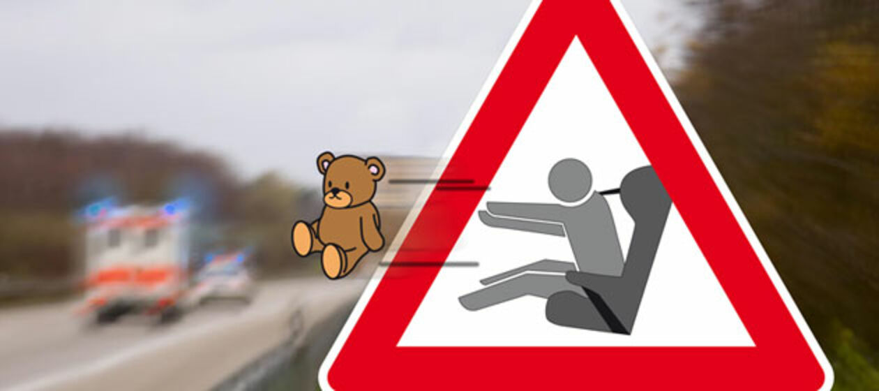 Ein Verkehrsschild, aus dem ein Teddybär herausgeschleudert wird
