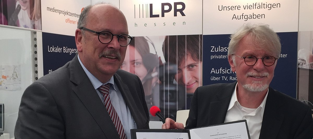 Hessischer Sozial- und Integrationsminister Stefan Grüttner und LPR-Direktor Joachim Becker